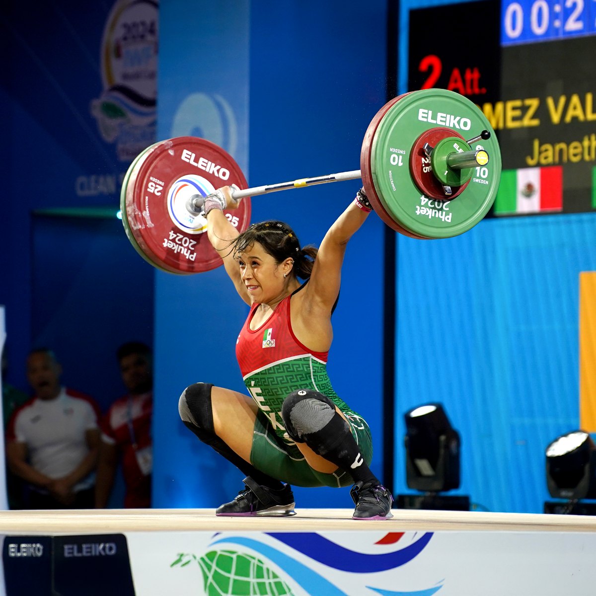 Weightlifter in action during competition.