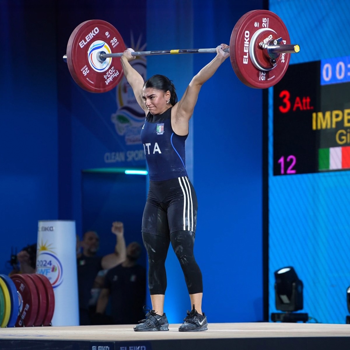 Weightlifter performing a clean and jerk.
