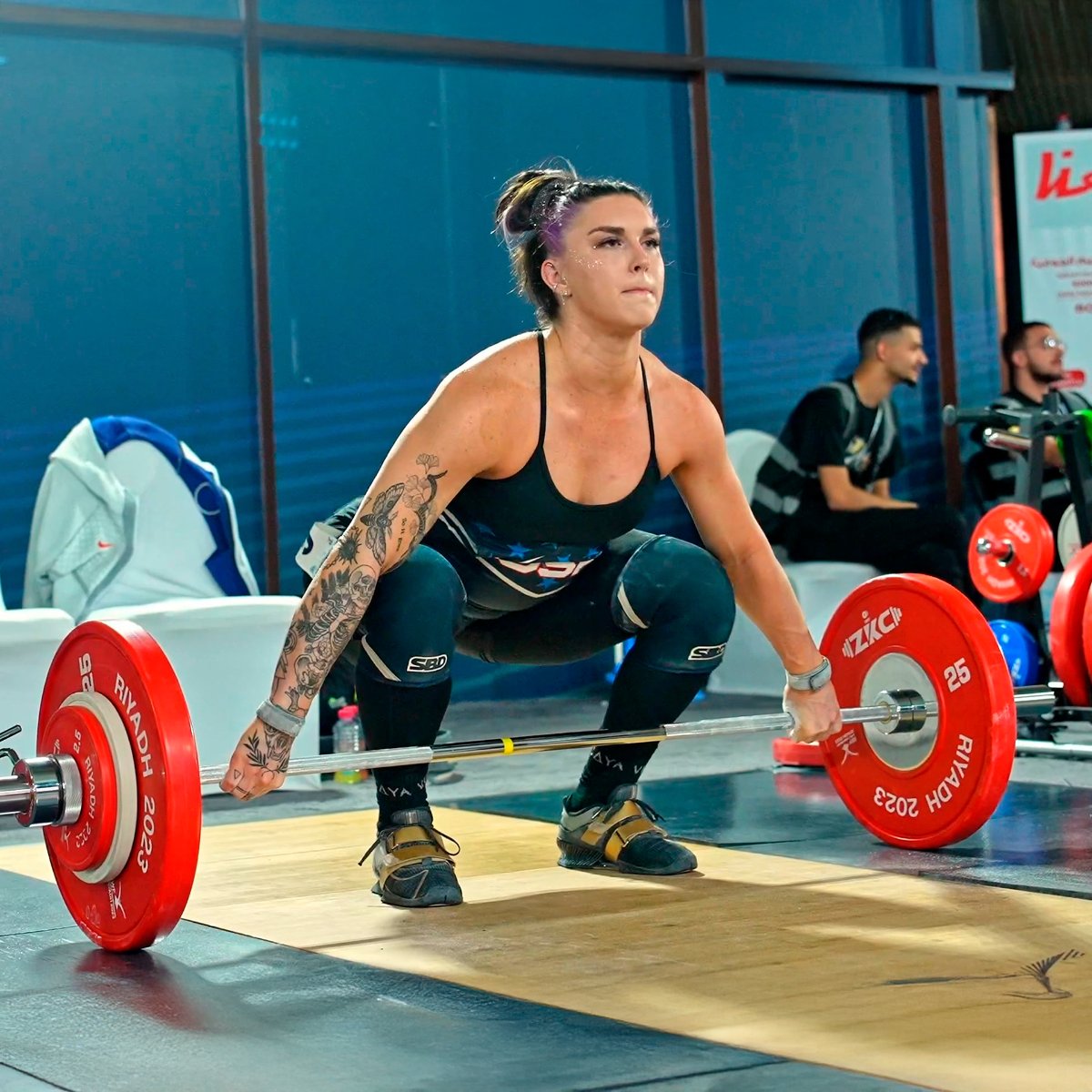 Athlete lifting weights in gym